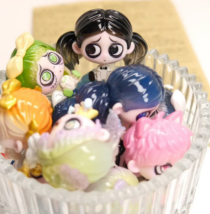 Kiki Sitting In A Row Bean toy doll